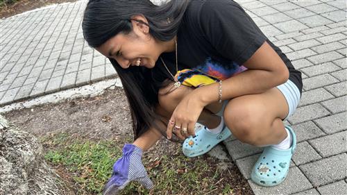 FBLA member pulls weeks on Beautification Day