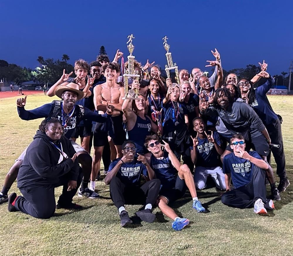 Track and Field teams celebrating with county championship trophies