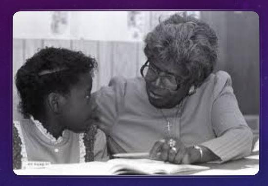 Johnson working with a student.