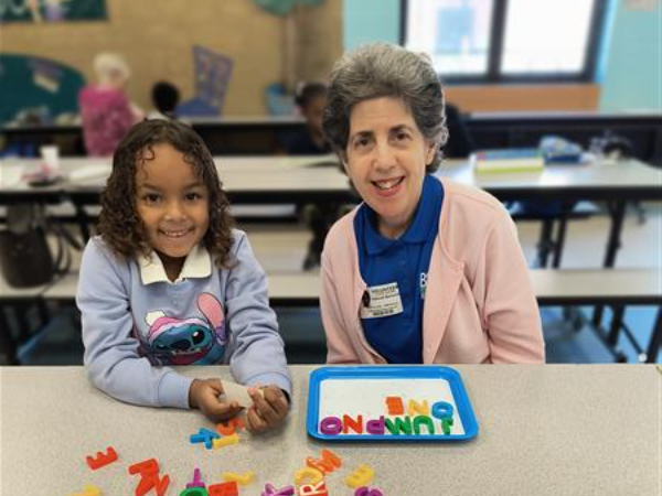 picture of student with a reader