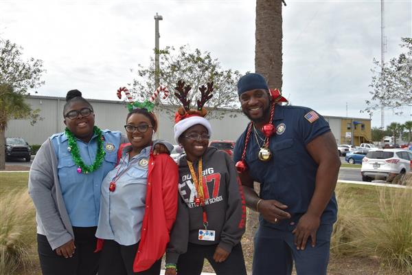 staff wearing Christmas bling