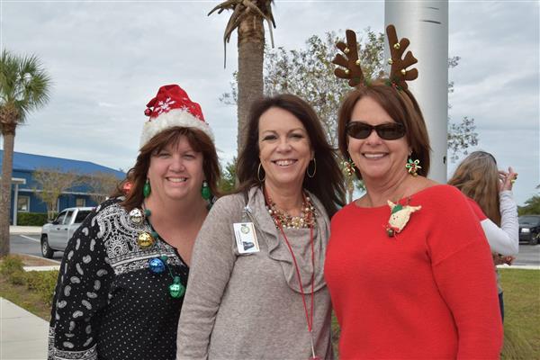 staff wearing Christmas bling