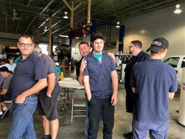guys goofing off while standing in buffet line