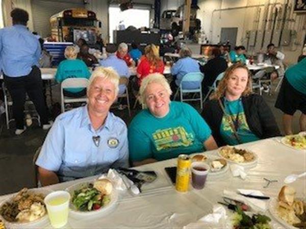 two ladies sitting at lunch table