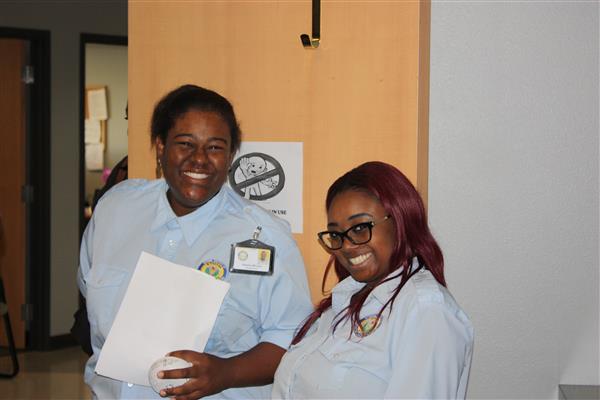 smiling staff pose for photo