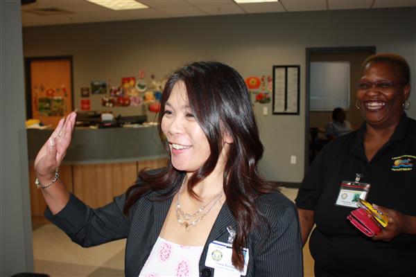staff wave as they enter the building