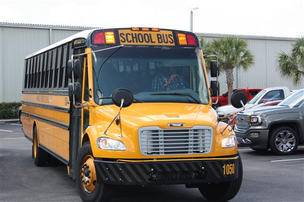 yellow school bus in parking lot